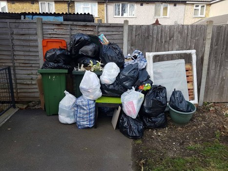 Community member sorting recyclables in Manor Park