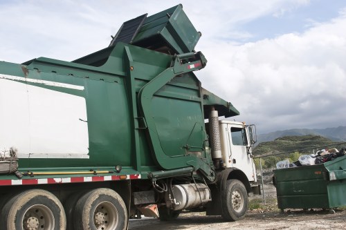 Workers sorting construction materials for recycling
