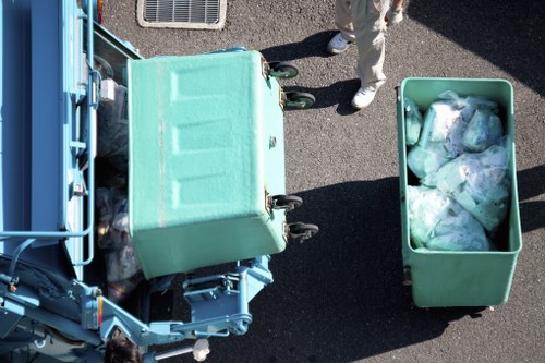 Garbage truck collecting waste in Manor Park